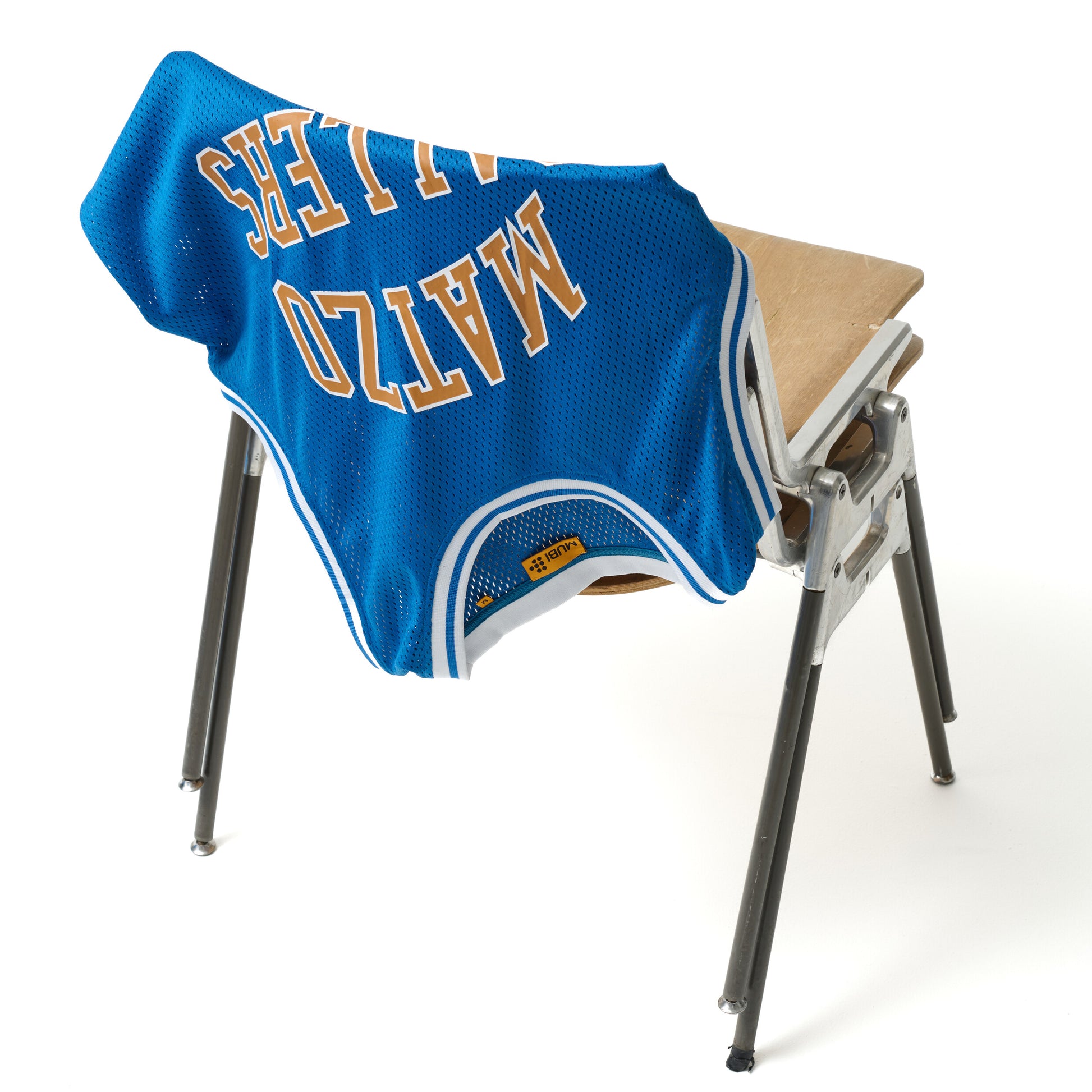 HAL & HARPER basketball jersey draped over a chair